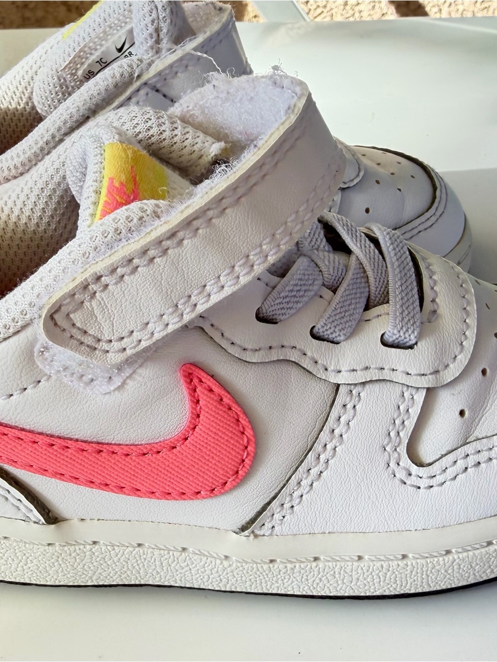 Nike Kids White Sneaker with Coral Pink Swoosh